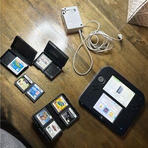Nintendo 2DS 
With charger and memory card and 9 games
